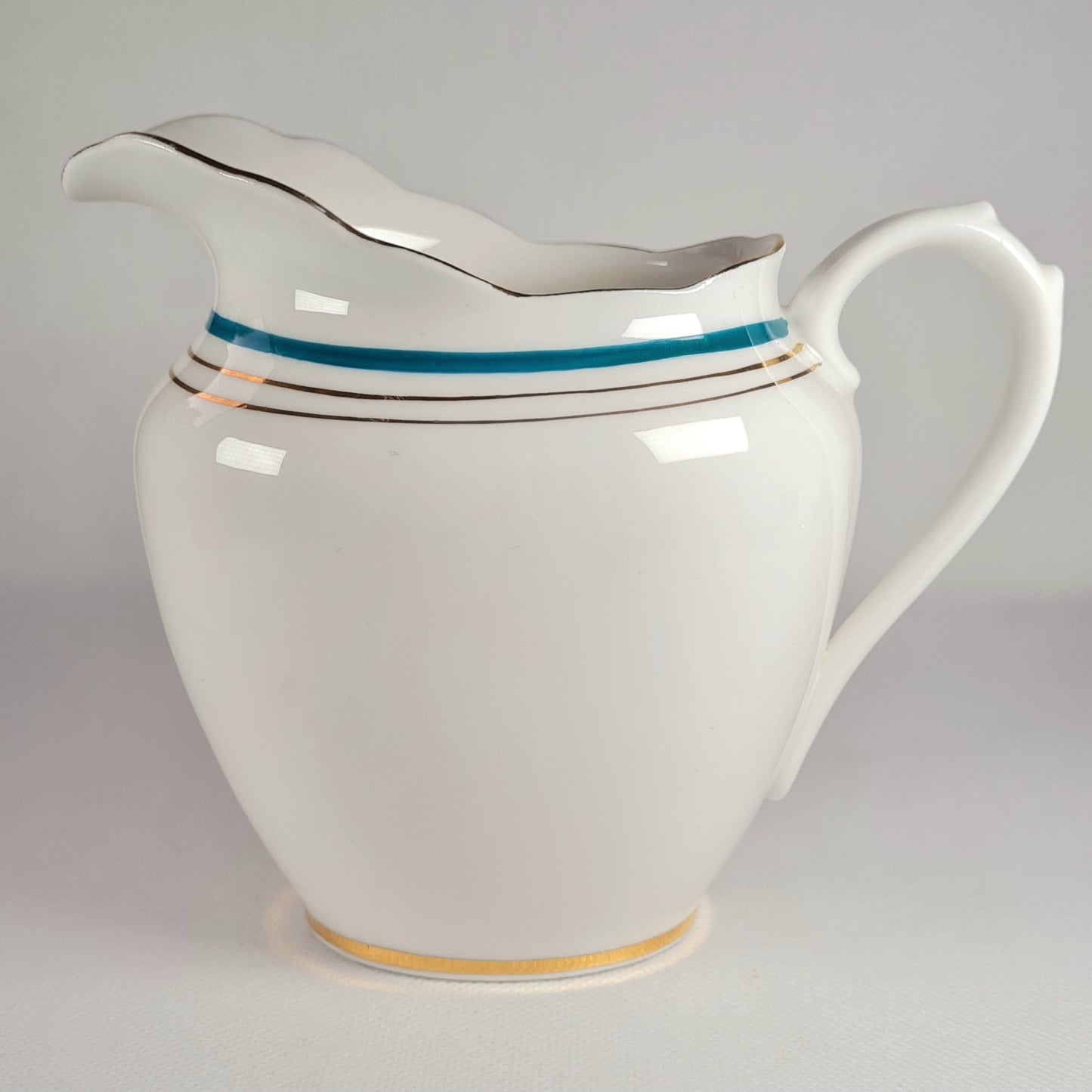 7 tea trio + lattiera + zuccheriera + piatto torta - Roslyn China