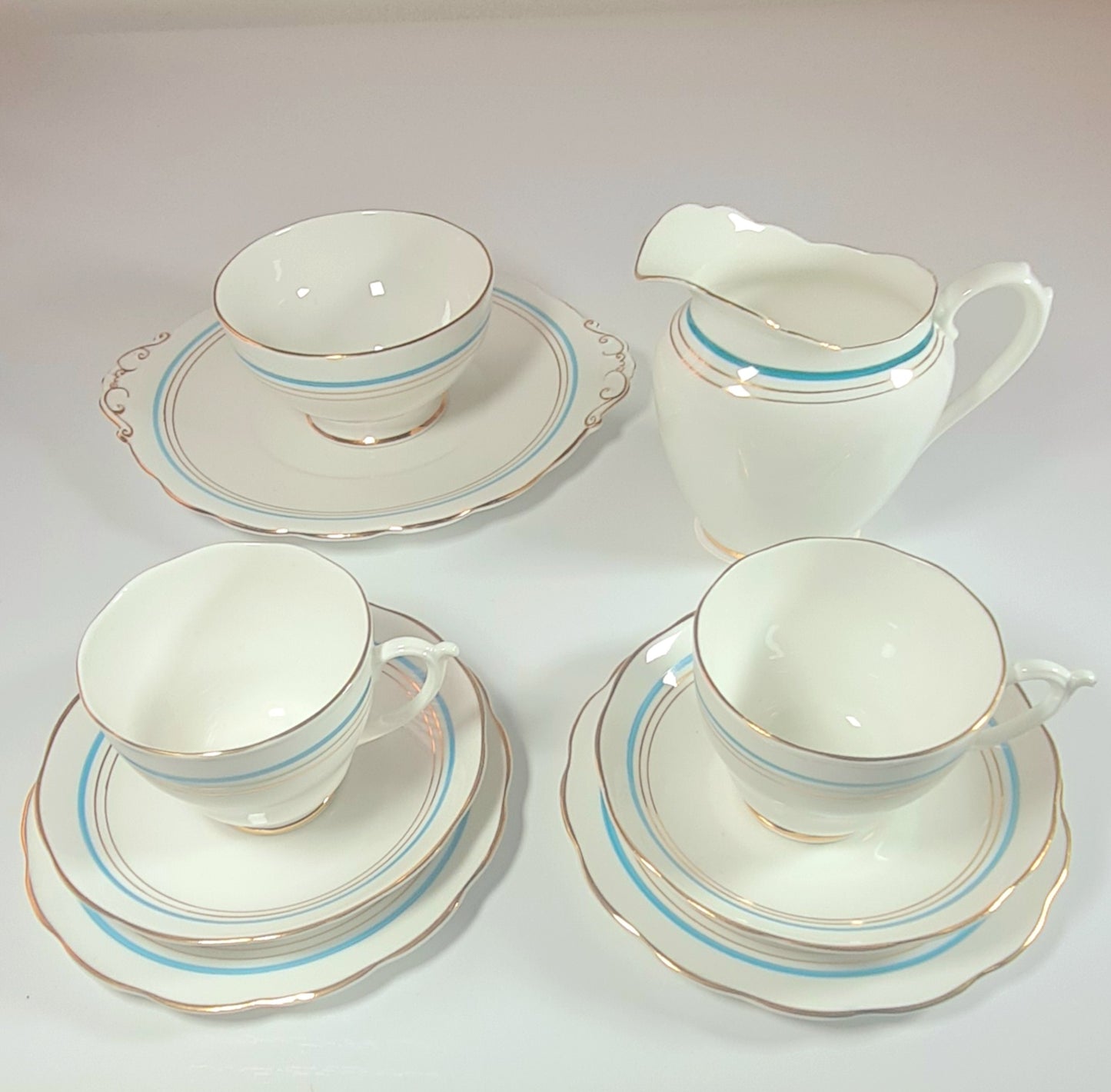 7 tea trio + lattiera + zuccheriera + piatto torta - Roslyn China