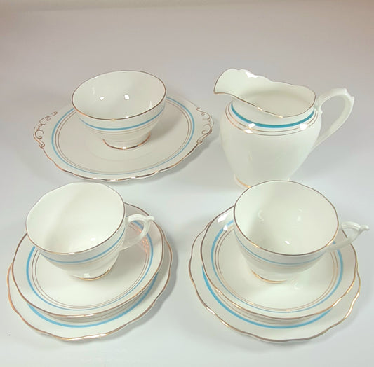 7 tea trio + lattiera + zuccheriera + piatto torta - Roslyn China